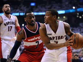 Toronto Raptors centre guard Kyle Lowry (7) controls the ball against Washington Wizards guard Ramon sessions (7) in the first quarter  in game two of the first round of the NBA Playoffs at Air Canada Centre. (Peter Llewellyn-USA TODAY Sports)
