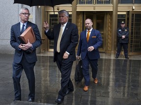 Former New York state Senate Majority Leader Dean Skelos, centre, and his son Adam depart United States Court in the Manhattan borough of New York City, June 1, 2015. The two pleaded not guilty on Monday to charges that they engaged in a corruption scheme, in the latest of a string of criminal cases against politicians in the state's capital of Albany. REUTERS/Mike Segar