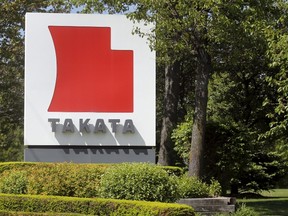 A sign with the Takata logo is seen along the driveway leading to the Takata Corporation building in Auburn Hills, Michigan, in this May 20, 2015 file photo. (REUTERS/Rebecca Cook/Files)
