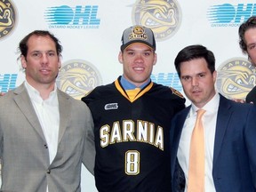 From left, Sarnia Sting co-owner David Legwand, defenceman Josh Jacobs, general manager Nick Sinclair and head coach Derian Hatcher pose for a photo during a press conference at RBC Centre on Monday June 1, 2015 in Sarnia, Ont. (Terry Bridge, The Observer)