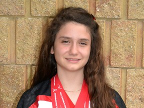 Twelve-year old karate black belt, Avery Anderson, poses with her gold medals after bringing home the top prize in both point and continuous sparring from the World Karate Championships Canada national tournament in Ottawa May 15-17. GALEN SIMMONS/MITCHELL ADVOCATE