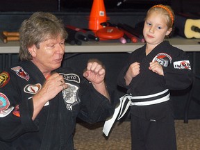 Steve Stewart, one of the co-founders of the International Modern Martial Arts Federation (IMMAF), taught a pair of classes for Wallaceburg Martial Arts on May 25. Here, Stewart teaches proper technique to student Kailey Hooper.