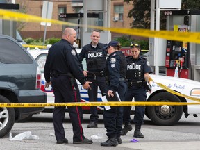 Scene at Lawrence Ave. and Bellamy Rd. where a man was found dead in a vehicle after being shot at Lawrence Ave. and Greencrest Circuit in Toronto on Monday June 1, 2015. (Craig Robertson/Toronto Sun)