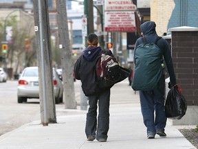 Homeless people make their way down Princess Street near Siloam Mission last month. (Kevin King/Winnipeg Sun)