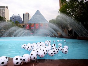 Hundreds of inflatable soccer balls float in the city hall wading pool to mark the upcoming FIFA Women's World Cup of Soccer, on Monday, June 1, 2015 in Edmonton, AB. Trevor Robb/Edmonton Sun