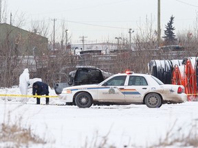 Strathcona RCMP investigate a suspicious death at a pipe yard near 84th Avenue and 34th Street in Strathcona County, Alta., on Tuesday, Dec. 30, 2014. The medical examiner attended the scene and removed a body. Ian Kucerak/Edmonton Sun