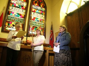 The Church of the Epiphany in Sudbury, Ont., began ringing the bells at the church starting on Monday June 1/2015, for more than 1,100 aboriginal women and girls who have gone missing or have been murdered in Canada. The bell ringing will happen over the next three weeks and by June 20, Epiphany's bells will have rung 1,122 times. Parishners Lorraine Campbell reads from the bible as Colleen Hill rings the bell, social worker Angela Nahwegahbow reads names of the missing women. Gino Donato/Sudbury Star/Postmedia Network