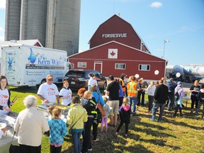 Guests at the first Breakfast on the Farm, held last June in Sarnia, line up for breakfast. This year's free event is set for Saturday, June 20. (Handout)