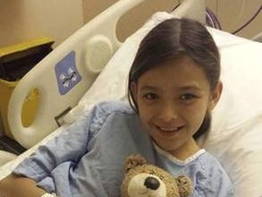 Winnipegger Allexis Giesbrecht, 11, underwent a liver transplant at a Toronto hospital on Monday. This photo was taken five minutes before she was wheeled into the operating room. (FACEBOOK PHOTO)
