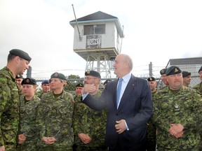 Julian Fantino, associate minister of national defence, tours the facilities of the Peace Support Training Centre on Canadian Forces Base Kingston, Ont. on Tues., June 2, 2015 after announcing a new centre will be built. Michael Lea/The Whig-Standard