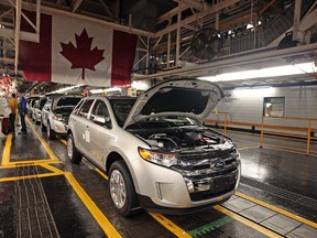 The 2013 Ford Crossovers roll off the line at the Ford Assembly plant in Oakville, Ont., in this January 4, 2013 file photo. (Dave Abel/Postmedia Network)