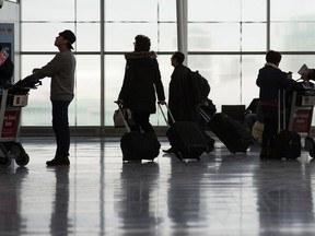 Travellers at Terminal 1 at Toronto Pearson International Airport in Mississauga, Ont. on Monday January 26, 2015. Ernest Doroszuk/Postmedia Network