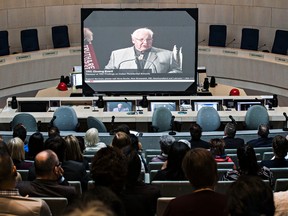 People pack the Edmonton city hall council chambers to watch the live of broadcast of the Truth and Reconciliation Commission’s release of its final report on Indian Residential Schools in Edmonton, Alta. on Tuesday, June 2, 2015. Codie McLachlan/Postmedia Network