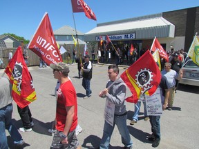 Demonstrators march outside of Sarnia-Lambton MP Pat Davidson's office on Tuesday June 2, 2015 in Sarnia, Ont. Federal public service workers say the government's budget bill undermines their collective bargaining rights. Another demonstration was planned for later in the day at the Blue Water Bridge. (Paul Morden, The Observer)