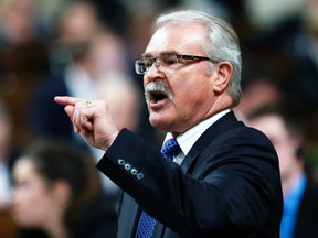 Canada's Agriculture Minister Gerry Ritz speaks during Question Period in the House of Commons on Parliament Hill in Ottawa, Dec. 4, 2014. (CHRIS WATTIE/Reuters)