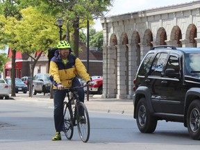 SAMANTHA REED/FOR THE INTELLIGENCER
City Councilor Egerton Boyce bikes down Front Street during his second day participating in the Quinte Commuter Challenge for Belleville's Bike Month.