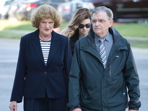 Ruth Burger walks with family members as she arrives for the second day of her trial at the court house in London, Ont. on Tuesday June 2, 2015. Burger is charged with two counts of criminal negligence causing death and two counts of criminal negligence causing bodily harm in the Costco crash last July that left Addison Hall and Rhiannon Bozek dead.  (Craig Glover/Postmedia Network)
