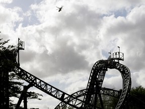 An air ambulance flies over the Smiler ride at Alton Towers in Alton, United Kingdom, June 2, 2015. (DARREN STAPLES/Reuters)