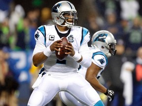 Panthers quarterback Cam Newton looks for an open man to pass to against the Seahawks during the NFC Divisional playoff game in Seattle on Jan. 10, 2015. (Joe Nicholson/USA TODAY Sports)