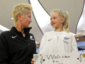 New Zealand team captain Abby Erceg chats with seven-year-old fan Kaelyn Cooper on the team's arrival at the Edmonton International Airport on Tuesday. (Perry Mah, Edmonton Sun)
