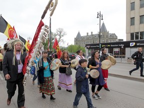 A group of people marched from the University of Winnipeg to Thunderbird House in Winnipeg, after hearing the findings of the Truth and Reconciliation Commission's findings.