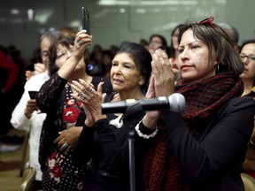 Attendees applaud at a Truth and Reconciliation Commission of Canada event in Ottawa June 2, 2015. The Truth and Reconciliation Commission of Canada presented its final report on the Indian Residential Schools.    REUTERS/Blair Gable