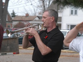 Long-time Wallaceburg District Secondary School music teacher Dave Babbitt performs The Last Post, at a 2011 Remembrance Day ceremony at Wallaceburg's cenotaph.