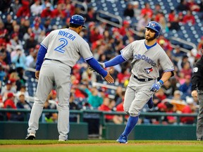 Toronto Blue Jays centre fielder Kevin Pillar is congratulated by third base coach Luis Rivera after hitting a solo home run against the Washington Nationals during the second inning at Nationals Park on June 2, 2015. (Brad Mills/USA TODAY Sports)