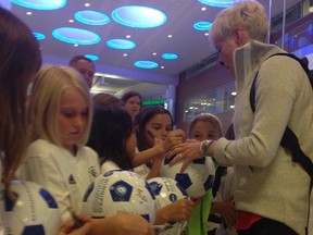 Team USA's Megan Rapinoe meets media and signs autographs for young players as the squad arrived in Winnipeg on Tuesday, June 2, 2015. David Larkins/Winnipeg Sun/Postmedia Network