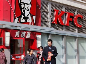 People walk past a KFC restaurant in Beijing, in this file photo taken Oct. 23, 2013.  REUTERS/Kim Kyung-Hoon/files