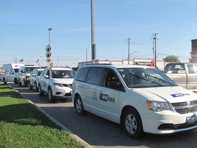 A parade of vehicles from Winmar lined up for Camp Day as the company donated more than $250 to the Tim Hortons Foundation. Ten vehicles pulled into the drive-thru lane at the restaurant at Grand Avenue East at 8:15 a.m. on Wednesday. (Blair Andrews/Chatham This Week)