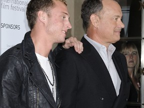 (L-R) Chester and Tom Hanks. (WENN.COM file photo)
