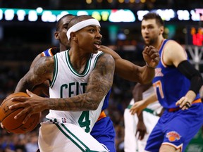 Boston Celtics guard Isaiah Thomas (4) drives to the hoop against the New York Knicks during the second half at TD Garden. (Mark L. Baer/USA TODAY Sports)