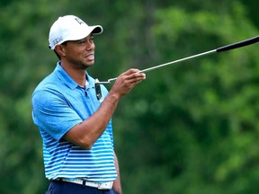 Tiger Woods points during the pro-am round for The Memorial Tournament at Muirfield Village Golf Club on June 3, 2015 in Dublin, Ohio.  (Sam Greenwood/Getty Images/AFP)
