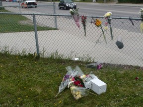 A vigil for Brett Bourne outside Kelvin High School June 3, 2015. Bourne was fatally stabbed at the scene June 2.
