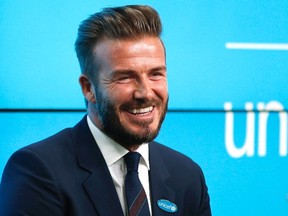 David Beckham smiles at a press conference to mark his 10 years as a UNICEF Goodwill Ambassador, at Google's headquarters in central London, February 9, 2015. (REUTERS/Peter Nicholls)