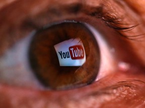 A picture illustration shows a YouTube logo reflected in a person's eye, in central Bosnian town of Zenica, early June 18, 2014. REUTERS/Dado Ruvic