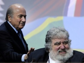 FIFA president Sepp Blatter (left) taps the shoulder of Charles Blazer, then general-secretary of CONCACAF, at the Zurich Hallenstadion in Oerlikon near Zurich. (AFP PHOTO/FABRICE COFFRINI)