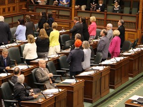 Ontario NDP Leader Andrea Horwath and her caucus turn their backs to show their disapproval after the Ontario Liberal government passes a budget bill on Wednesday June 3 2015 that paves the way for the partial sale of Hydro One. (Toronto Sun/Antonella Artuso)