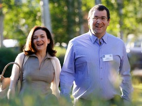 Sheryl Sandberg, chief operating officer (COO) of Facebook, arrives with her husband David Goldberg, CEO of SurveyMonkey, for the first day of the Allen and Co. media conference in Sun Valley, Idaho in this July 9, 2014, file photo.  REUTERS/Rick Wilking/Files