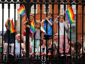 Children wave rainbow flags as they stand with their same-sex marriage supporting parents at Dublin Castle May 23, 2015.