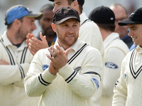 New Zealand skip Brendon McCullum applauds his team after their match against England on Tuesday. (REUTERS)