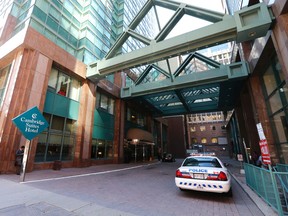 Toronto Police on the scene of the Cambridge Suites Hotel on Richmond Steet in downtown Toronto where a 12-year-old boy was found murdered Wednesday June 3, 2015. (Michael Peake/Toronto Sun)