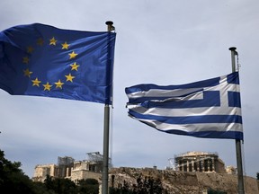 A European Union flag (L) and a Greek national flag flutter as the ancient Parthenon temple is seen in the background in Athens June 1, 2015. Greece and its European creditors agreed on the need to reach a cash-for-reforms deal quickly as Athens missed a self-imposed Sunday deadline for reaching an agreement to unlock aid, sources close to the talks said. REUTERS/Alkis Konstantinidis