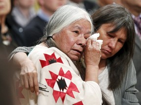 Residential School survivor Lorna Standingready (L) is comforted during the Truth and Reconciliation Commission of Canada closing ceremony at Rideau Hall in Ottawa, June 3, 2015.    REUTERS/Blair Gable