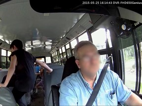 One student kicks another student while riding on an Edmonton Catholic School bus after school on May 25, 2015. Frame Grab From Video