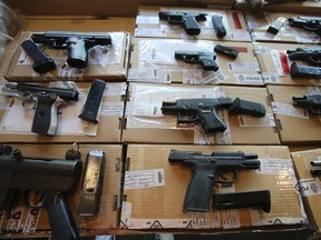 Guns seized in Project Traveller raids. (Jack Boland/Toronto Sun)