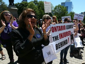 Hundreds protest the Ontario government’s proposed auto insurance cuts outside Queen's Park in Toronto on June 3, 2015. (Dave Abel/Toronto Sun)