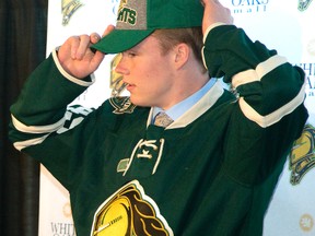 Max Jones adjusts his Knights cap at Budweiser Gardens on Wednesday after it was announced the power forward has left the U.S. development program to play for the London Knights this fall. (MIKE HENSEN, The London Free Press)