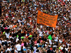 At Commonwealth Stadium, the site of the 2015 Women's World Cup, fans cheer and laugh in this May 27, 1990 file photo. (Tom Braid/Edmonton Sun/Postmedia Network)